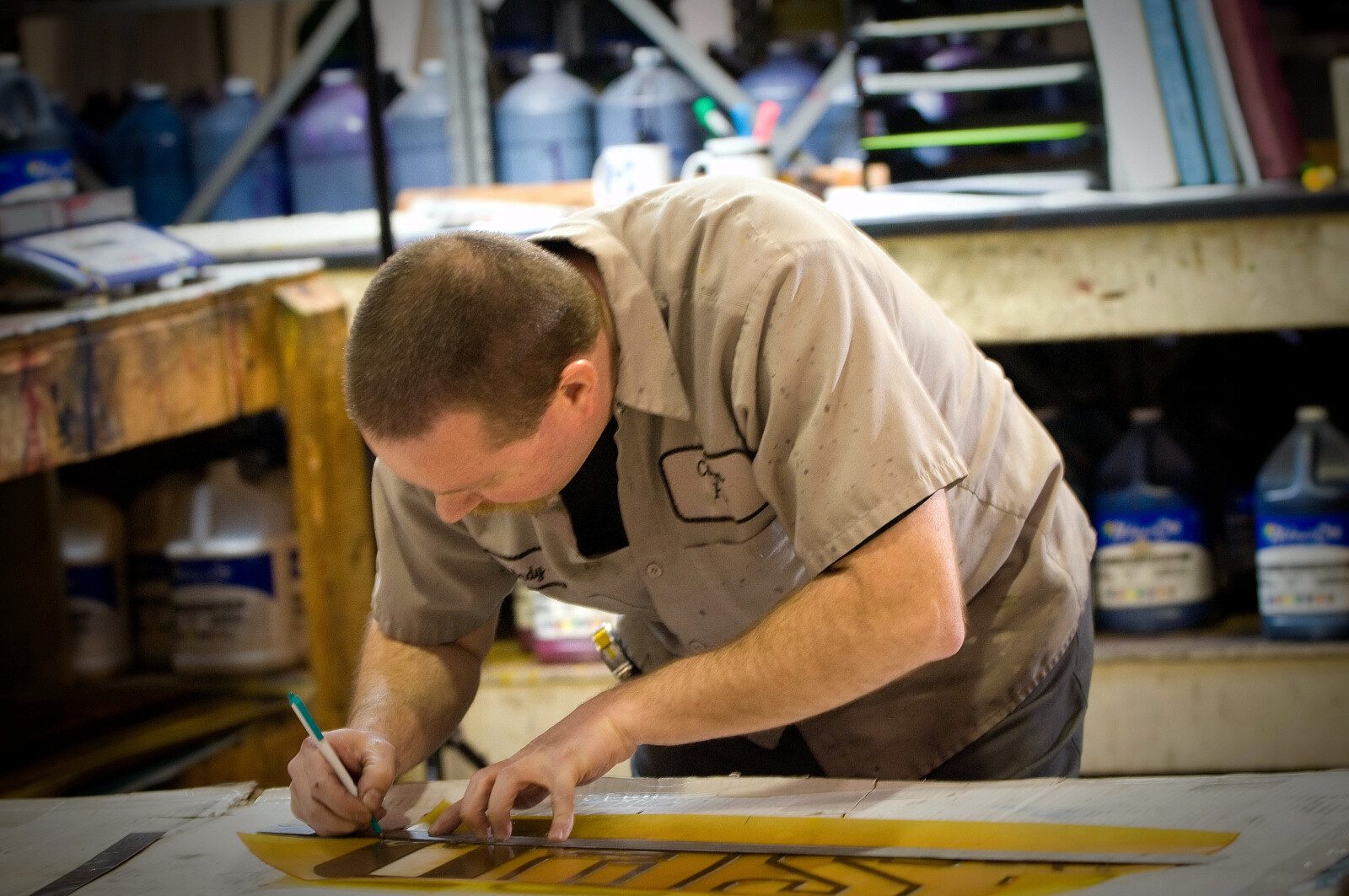 worker drafting poly bag design
