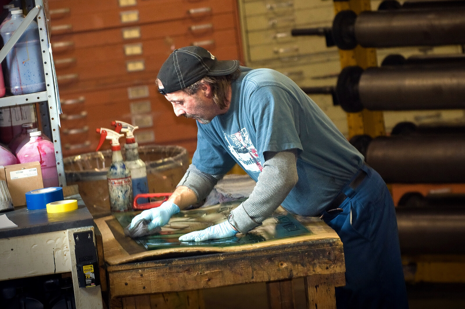 worker cleaning poly bag design